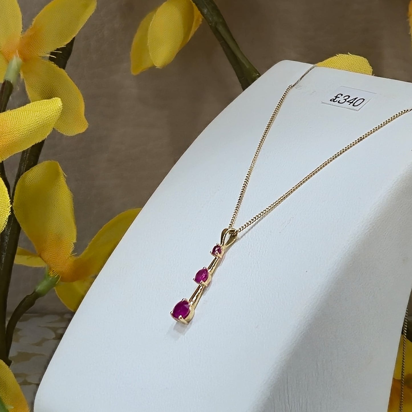 9ct Yellow Gold 3 Stone Ruby Drop Pendant on 18 inch chain