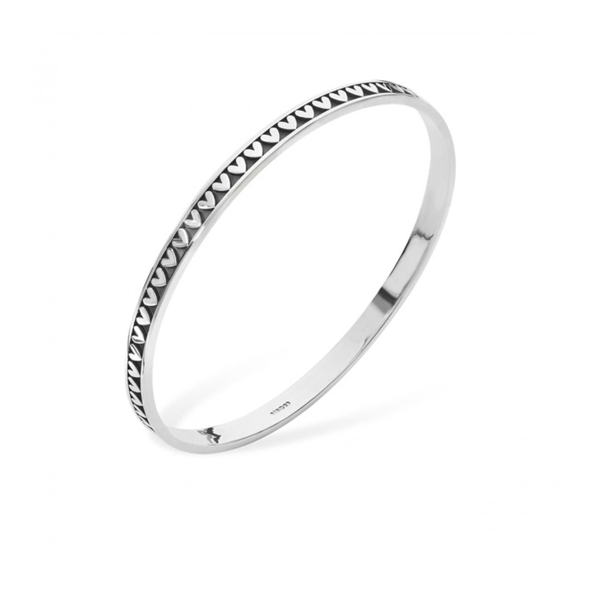 Romantic repeat pattern heart bangle.